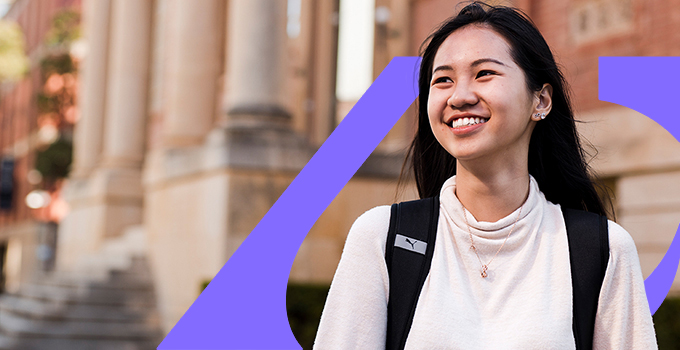 Person standing in front of AU graphic